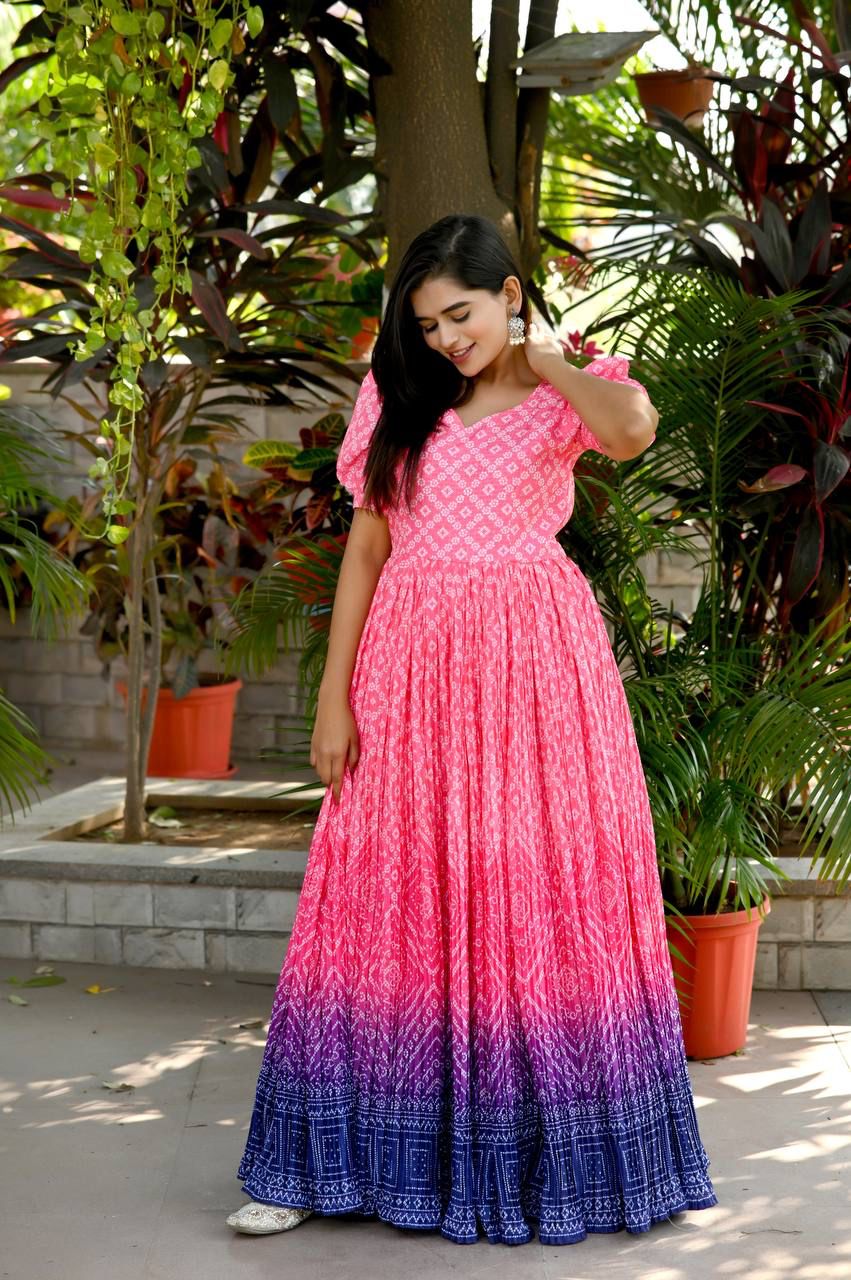 Be the center of Attractions with this Bandhej Printed ,Chinnon crush pleating and Crochet Maslin designer gowns, Select this with one blink and add in your wardrobe.