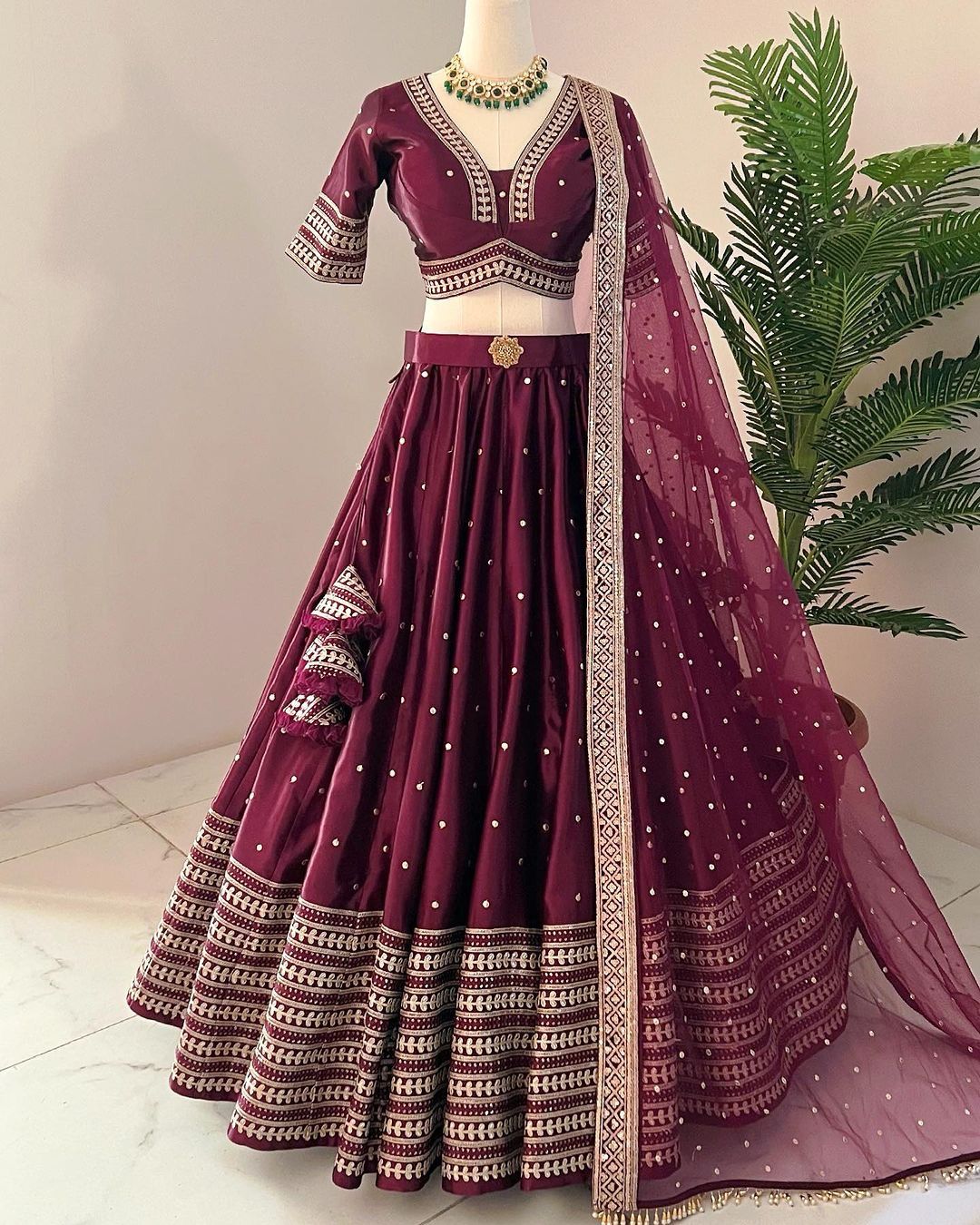 This expertly crafted piece is known for its vibrant colors, intricate embroidery, and luxurious fabrics. Expertly designed and made with the highest quality materials, this garment is sure to make a statement at any event.details