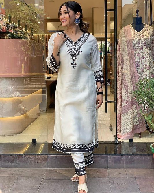 Black &amp; White Anarkali Suit Set you've described seems to be a party wear outfit made from Maslin fabric with digital prints.